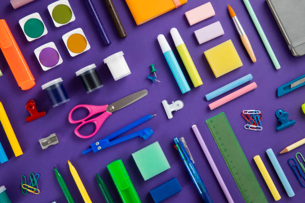 istock School Supplies on Purple Background 1462085493