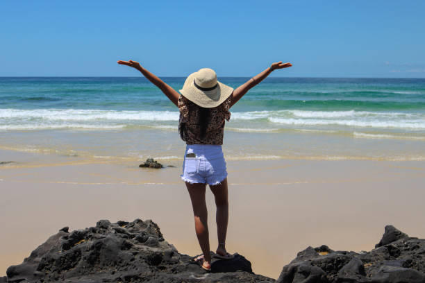 Amazing sunny beach day in Fraser Island located in Queensland, enjoying the calm and relax vibe of the island. beautiful latin American model