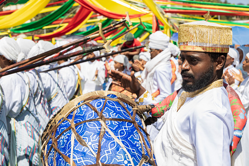 Addis Ababa, Ethiopia -  January 19, 2023: Choir of men and women perform hymns during Timkat, celebrations. \nTimket is an Ethiopian Orthodox Tewahedo Church celebration of Epiphany. It is celebrated on 19 January (or 20 in a leap year), corresponding to the 11th day of Terr in the Ge'ez calendar. \nOn this day, crowds assemble together with priests who  are carrying over their heads covered replicas of the \