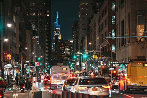 Traffic in Lower Manhattan New York at night, new Hudson Yards buildings on the background