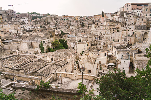 Panoramic view of Sassi di Matera a historic district in the city of Matera, well-known for their ancient cave dwellings from the Belvedere di Murgia Timone,  Basilicata, Italy