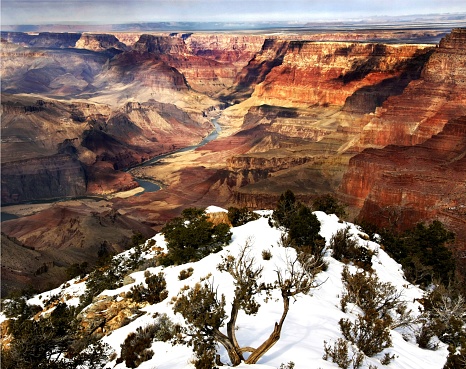 A scenic aerial view of scattered white snow in Grand Canyon National Park in Arizona