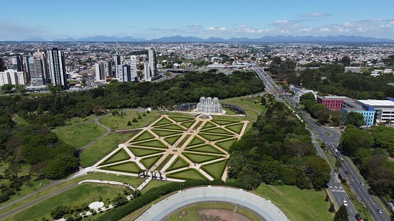 An aerial view of the Curitiba city in Brazil with lush green vegetation and parks