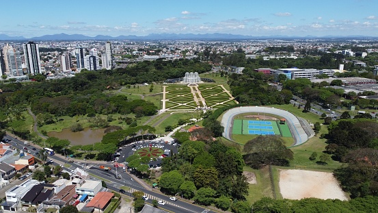 An aerial view of the Curitiba city in Brazil with lush green vegetation and parks