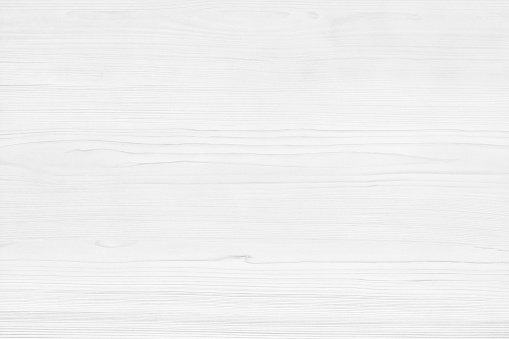 White wooden table close-up surface texture. Light grey wood grain background