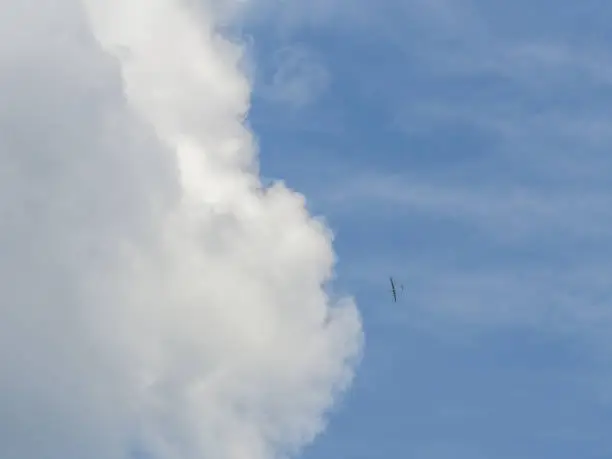 Small glider airplane in the sky
