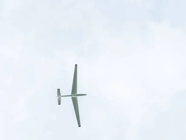 Small private glider airplane in the sky