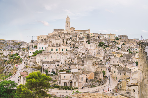 View of the ancient town and historical center called Sassi, perched on rocks on top of hill, Matera, Basilicata, Italy.