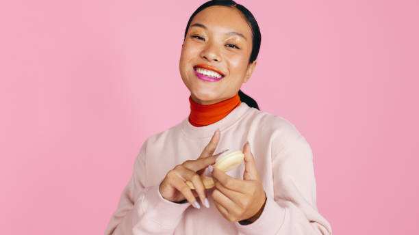 istock Fun with foundation: Woman applying cream foundation in a studio 1462119216