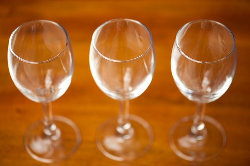3 wine glasses line up.