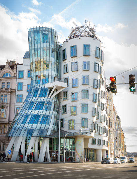 Dancing House or Fred and Ginder Building in Prague On December 30th 2022, the Dancing house in Prague, the famous modern and unique building design by Frank Gehry and Vlado Milunich that stand in front of the Vltava River. It houses offices and a bar and a restaurant on top to enjoy the view. The building was originally called Fred and Ginger after the renown dancers because its design resembles two dancers. prague art stock pictures, royalty-free photos & images