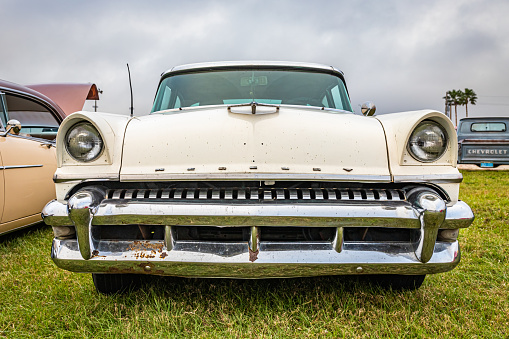 Daytona Beach, FL - November 26, 2022: Low perspective front view of a 1955 Mercury Montclair 4 Door Sedan at a local car show.