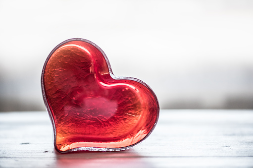 Red Glass Heart on White Wooden Table