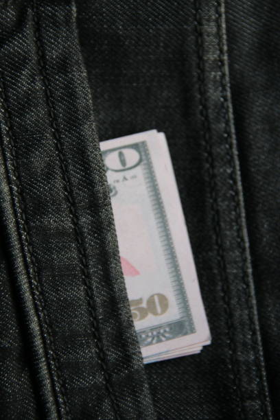 istock American dollars USD banknotes in jeans pocket. 1462136741