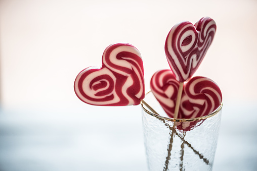 Heart Shape Lollipops in Champagne Flute, Valentine´s Day Concept