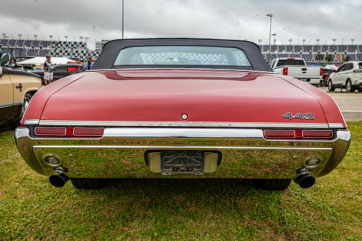 Daytona Beach, FL - November 26, 2022: Low perspective rear view of a 1968 Oldsmobile 442 Convertible at a local car show.