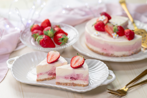 Sliced strawberry no-bake cheesecake. Gelatine dessert with strawberry
