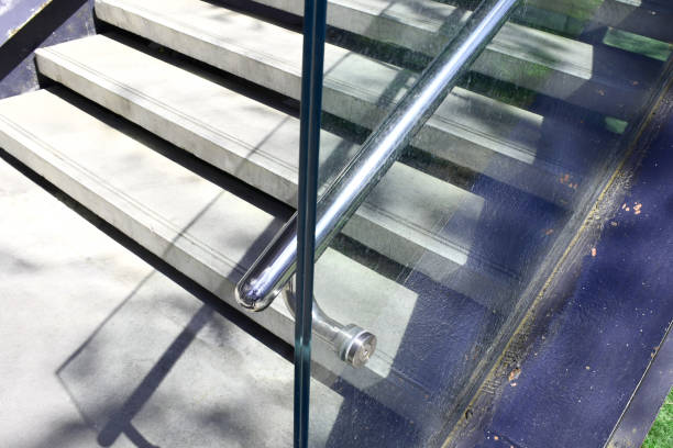 istock Tempered laminated glass railing balustrade panels frame less ,safety glass for modern architectural buildings. Concept for Aluminum balcony or terrace design with glazing profile. Company and industry portfolio image. 1462151138