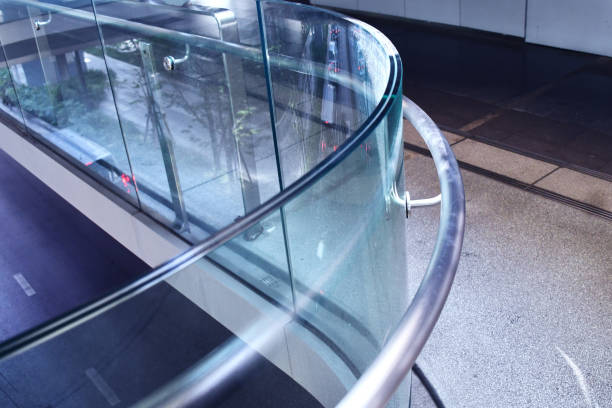 istock Curve tempered laminated glass railing balustrade panels frame less ,safety glass for modern architectural buildings. Concept for Aluminum balcony or terrace design with glazing profile. Company and industry portfolio image. 1462151155