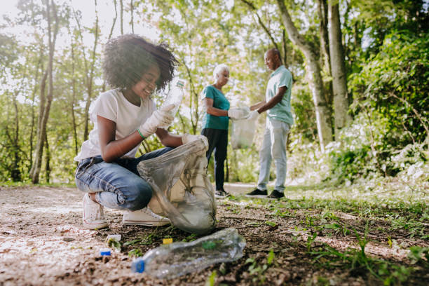 istock Girl collecting garbage from nature 1462151775