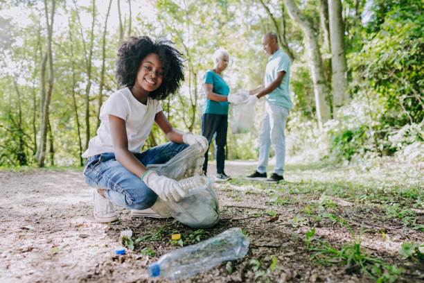 istock Girl collecting garbage from nature 1462151791