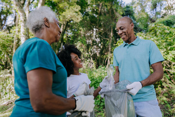 istock Three generation family picking up garbage in nature 1462151874