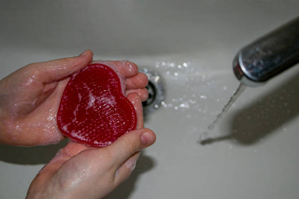 istock The child washes his hands with heart-shaped soap. 1462154479