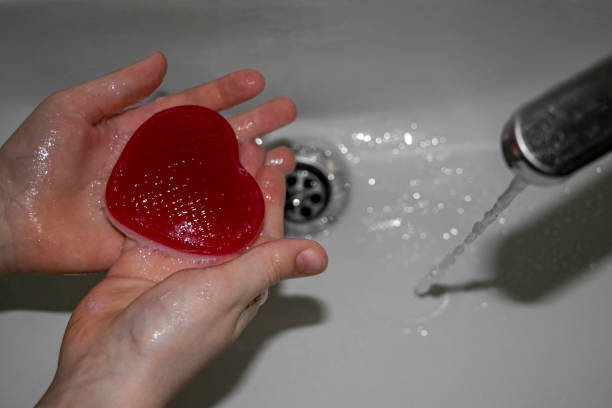 istock The child washes his hands with heart-shaped soap. 1462154481