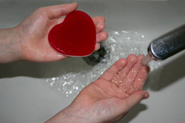istock The child washes his hands with heart-shaped soap. 1462154490