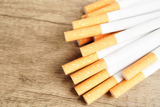 istock Cigarette, roll tobacco in paper with filter tube, No smoking concept. 1462158564