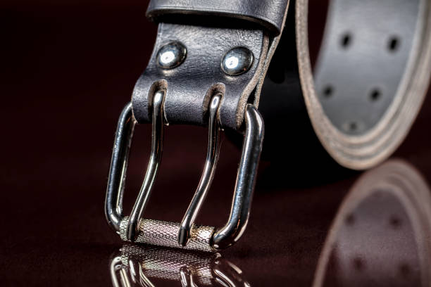 istock Black leather belt on a dark background. Leather products. 1462172646