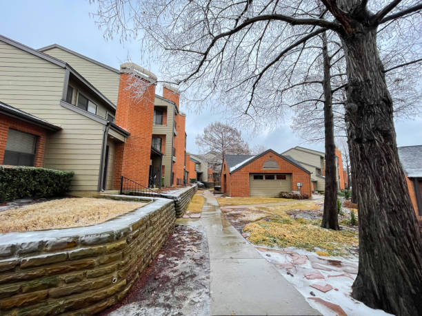 istock High terrain wall along concrete pathway with snow and ice covered at apartment complex near Dallas, Texas, America after winter storm 1462172758
