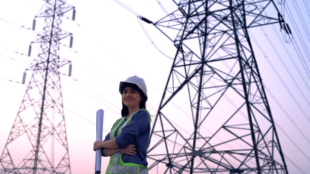 istock specialist electrical engineer working near to High voltage tower. 1462174756