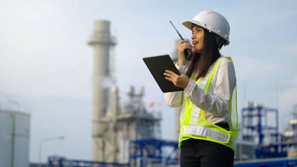 istock Industrial engineer using digital tablet for work against the background of electrical power plant. 1462175328
