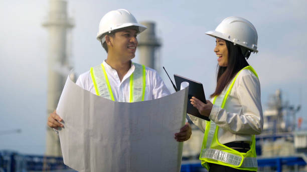 istock Two industrial engineer working near the electrical plant. 1462175387