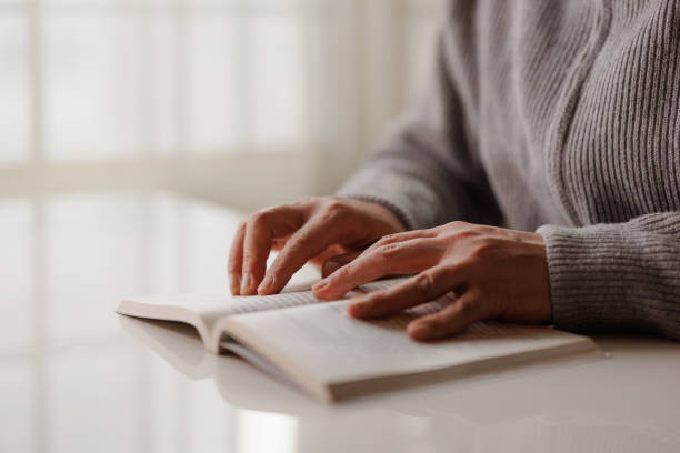 istock man is reading on the balcony, holding up a close-up 1462183862