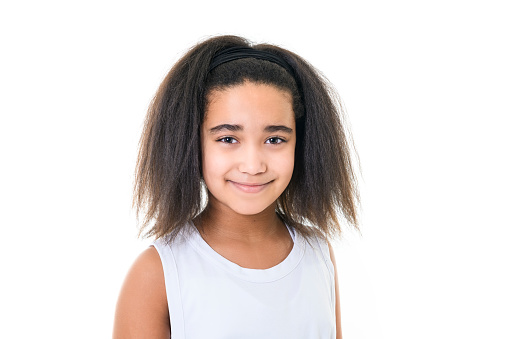 An Adorable 9 years child girl on studio white background
