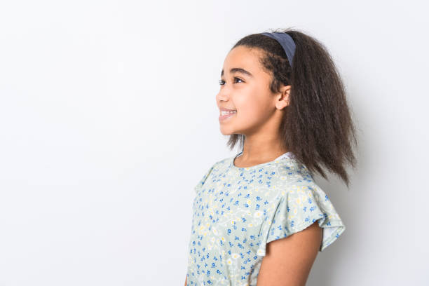 istock Adorable 9 years child girl on studio white background 1462187558