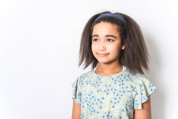 istock Adorable 9 years child girl on studio white background 1462187560