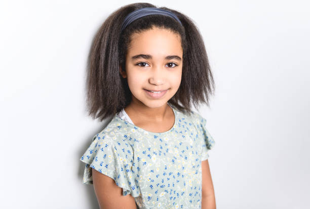 istock Adorable 9 years child girl on studio white background 1462187592