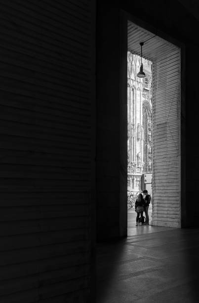 People standing next to il duomo in Milan