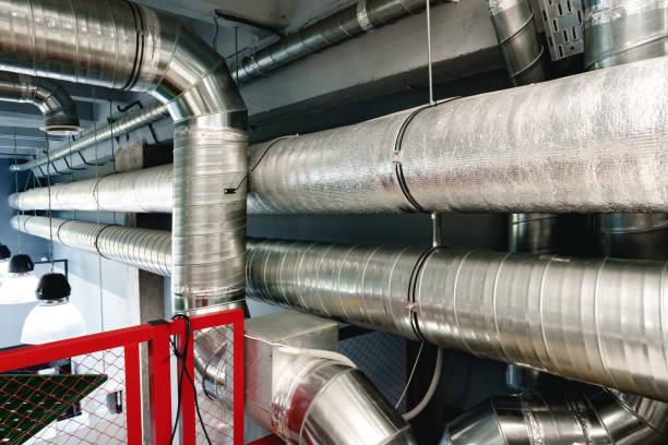istock Silver ventilation pipes hanging from the ceiling inside the building 1462187866