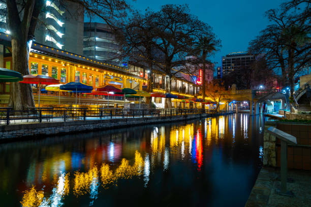 istock San Antonio River Walk nightscape over the canal footpath illuminated by the vibrant lights and water reflections in winter, Texas, USA 1462192525