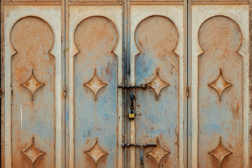 Detail of a metal, slightly rusted Arab-style door