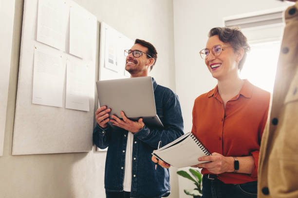 istock Cheerful businesspeople having a meeting in a creative workplace 1462193849