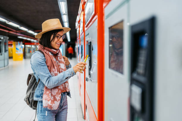 istock Young Woman Buying A Ticket Using Phone For A Subway Train In Milan 1462193893