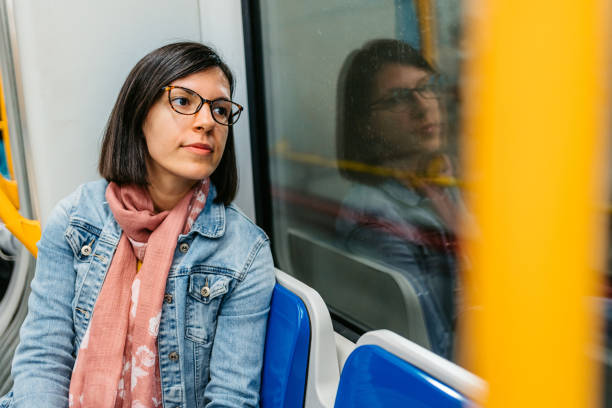 istock Young Woman Looking Out The Window In A Subway Train 1462193957