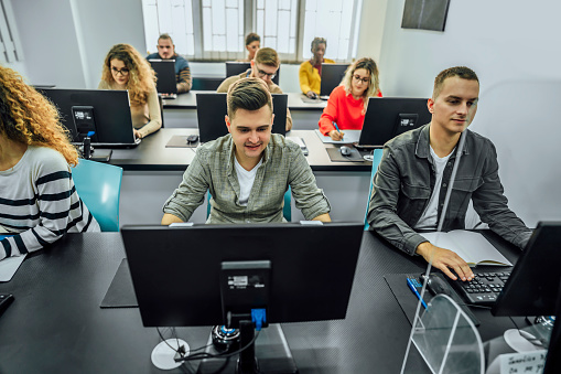 Students learning computer programming in programming school