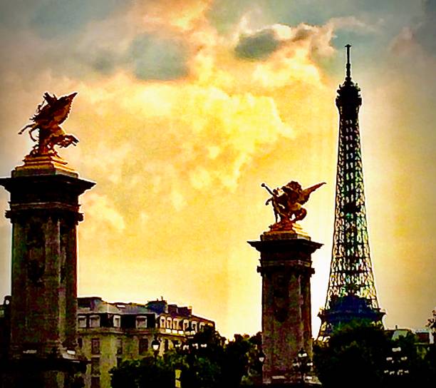 Photo taken from the Seine River which highlights the Eiffel Tower and Paris bridges