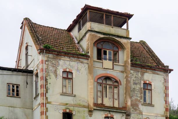 istock Antique abandoned multi-storey house with tile roof 1462201369